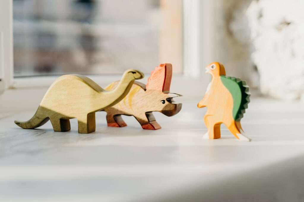 photo of wooden dinosaur toys